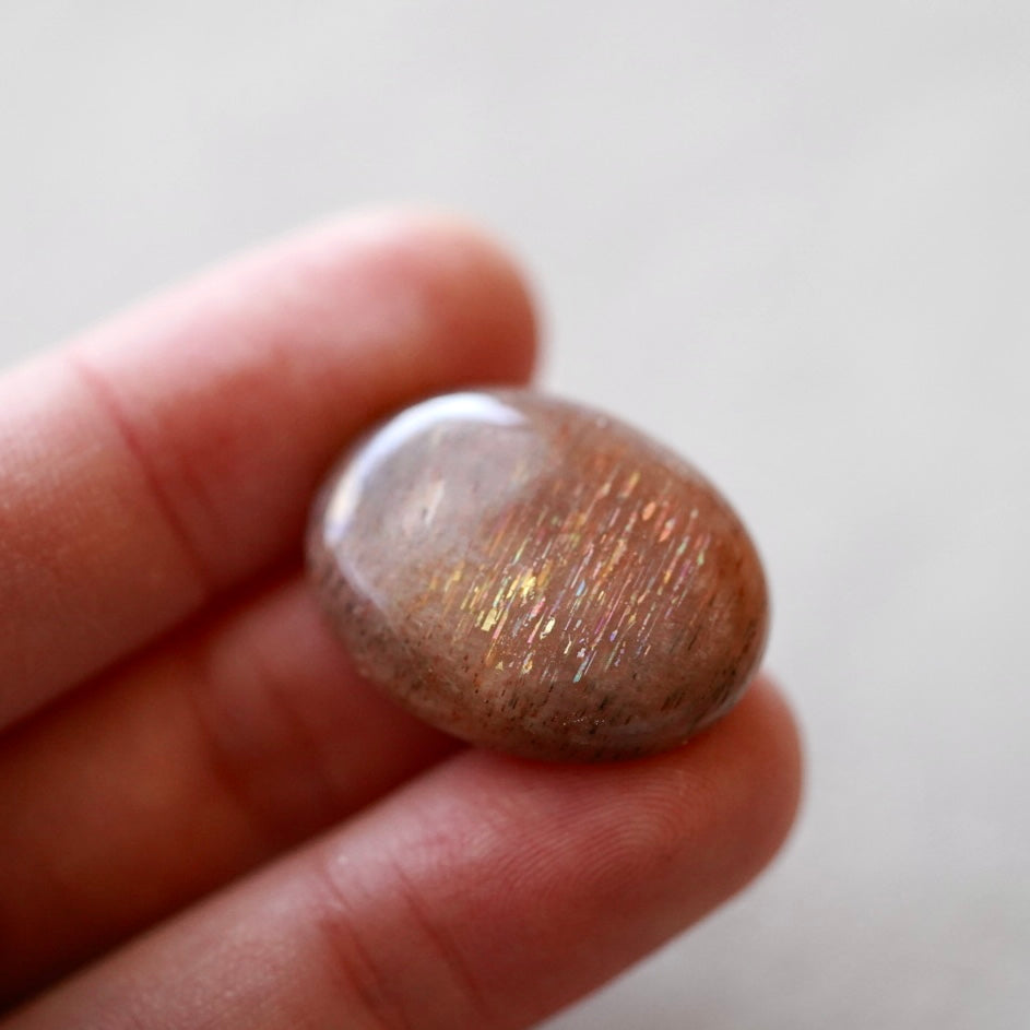 Rainbow 'Meteor Shower' Sunstone Oval Cabochon - 25 x 19mm (D-W2)