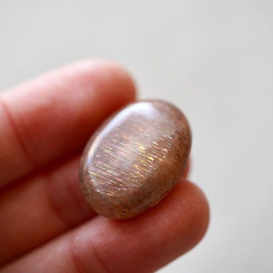 Rainbow 'Meteor Shower' Sunstone Oval Cabochon - 25 x 19mm (D-W2)