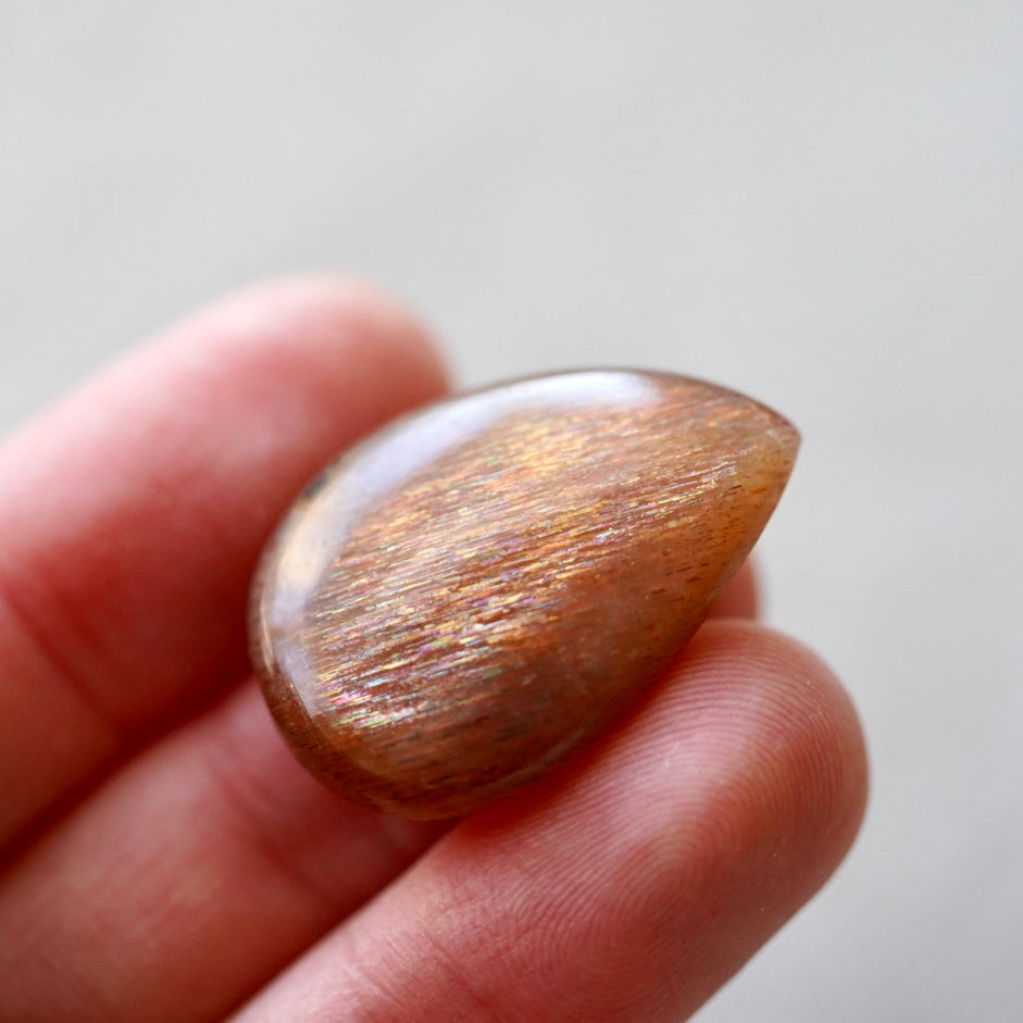 Rainbow 'Meteor Shower' Sunstone Cabochon - 28 x 20mm (C-W2)